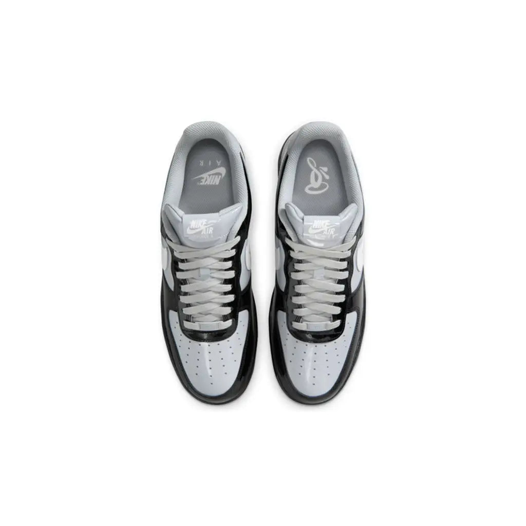 Pair of gray and black sneakers on a white background